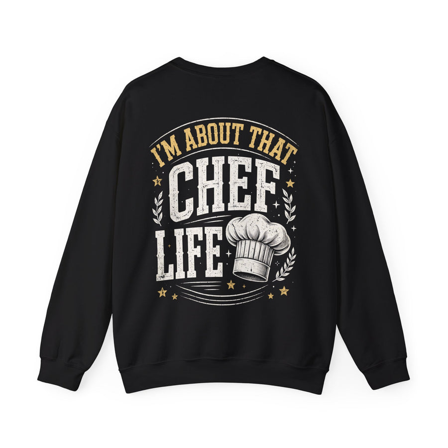 Black sweatshirt with cream bubble lettering reading I'M ABOUT THAT CHEF LIFE, front view.