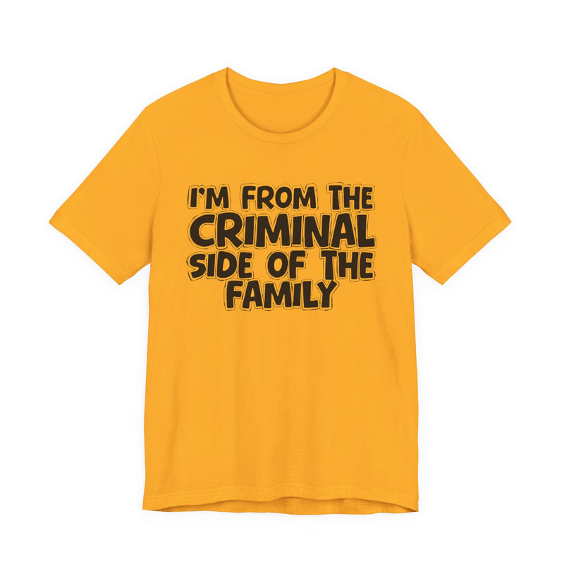 Gold t-shirt with 'I'M FROM THE CRIMINAL SIDE OF THE FAMILY' in black hand-drawn bubble lettering on the chest, front flat-lay mockup view.