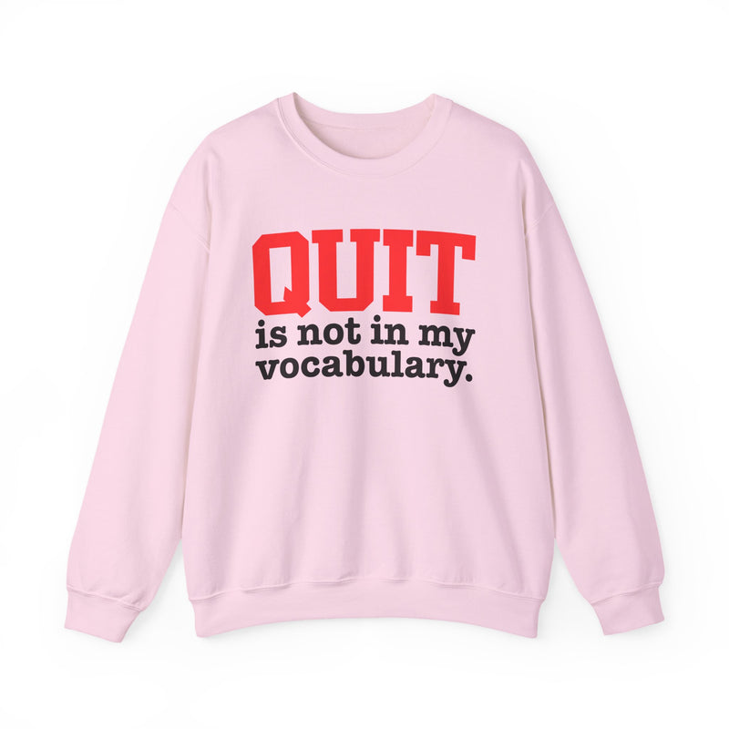 Light Pink sweatshirt with black and red block lettering reading "QUIT is not in my vocabulary.", front flat-lay view.