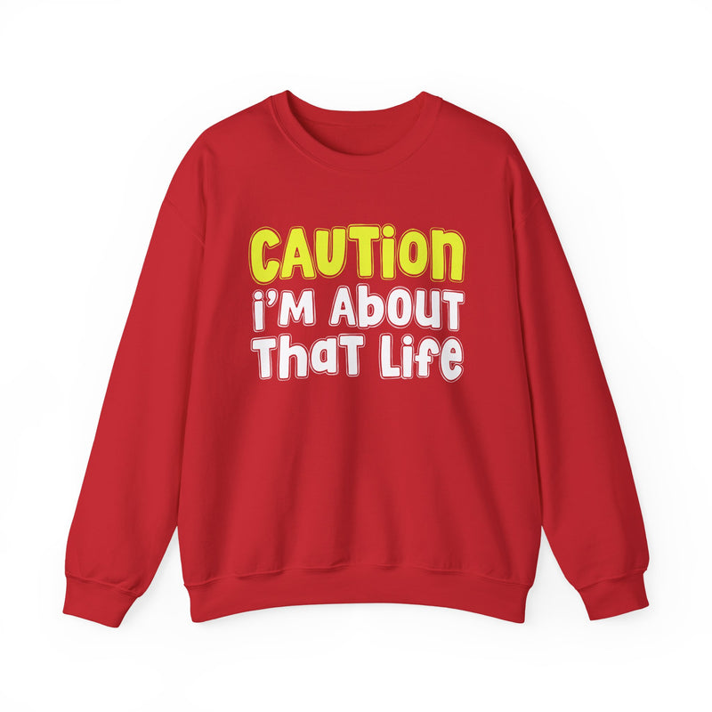 Sweatshirt in Black with lettering reading CAUTION I'M ABOUT THAT LIFE, front view