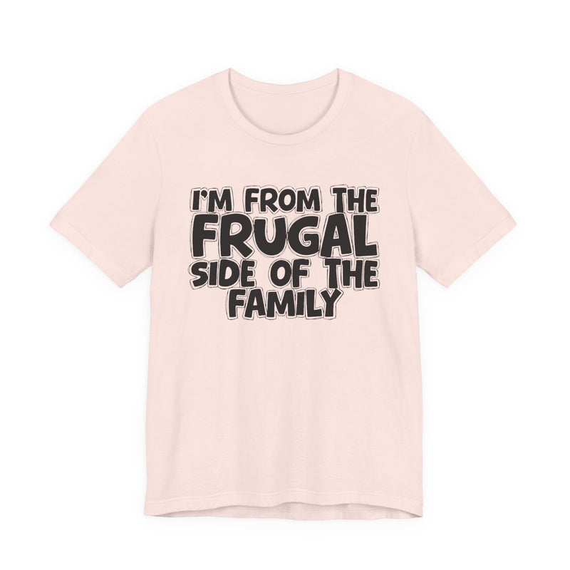 Soft Cream t-shirt with 'I'M FROM THE FRUGAL SIDE OF THE FAMILY' in black hand-drawn bubble lettering on the chest, front flat-lay mockup view.