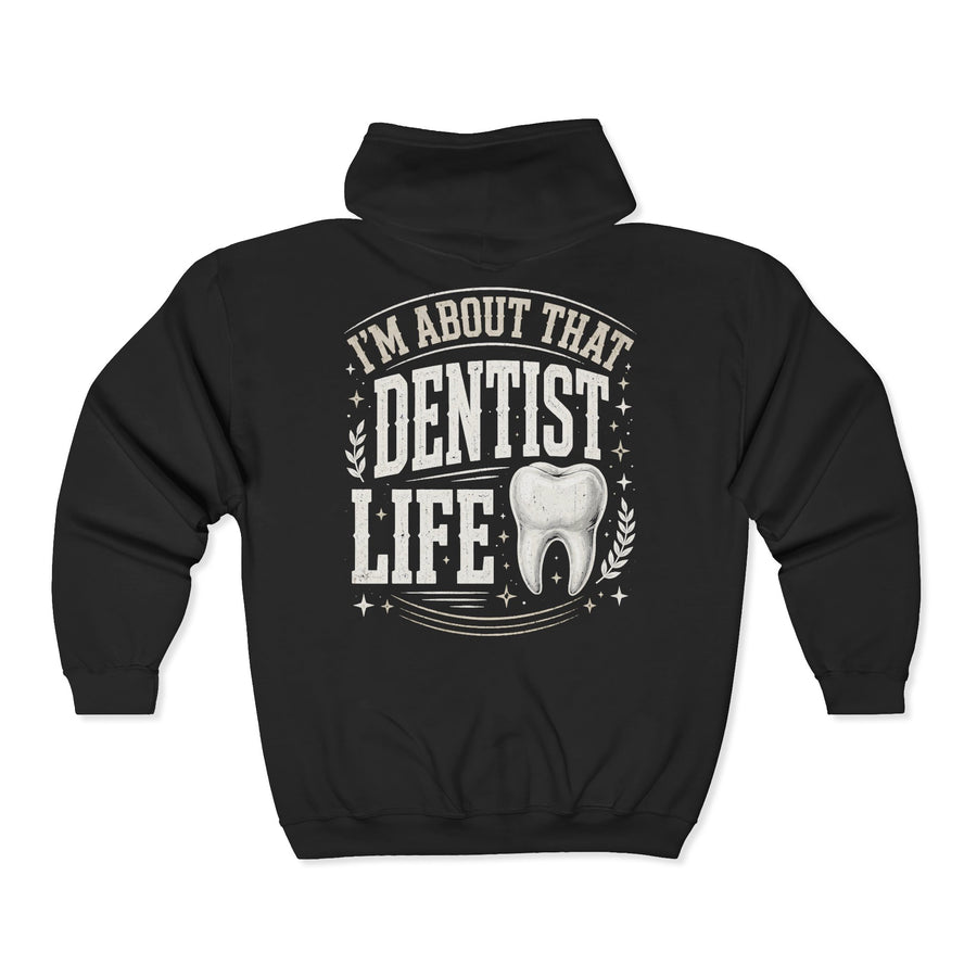Black zip hoodie with white bubble lettering reading I'M ABOUT THAT DENTIST LIFE, back view.