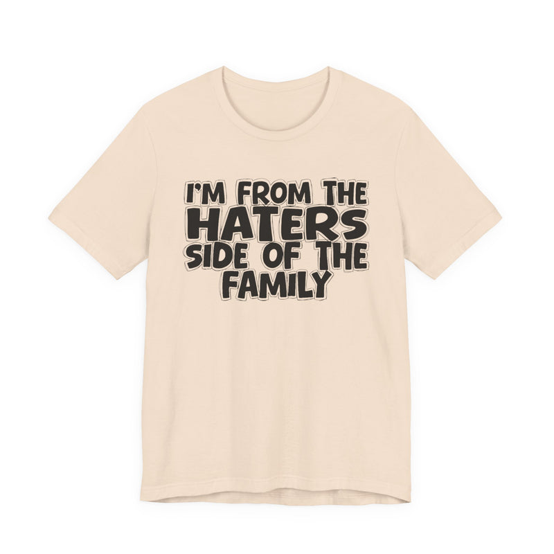 Gold t-shirt with bold chest statement text reading 'I'M FROM THE HATERS SIDE OF THE FAMILY,' front flat-lay view.
