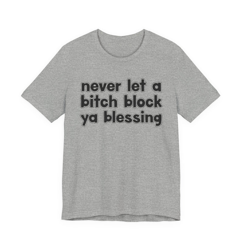 Heather gray t-shirt with white lettering reading "never let a bitch block ya blessing", front flat-lay view.