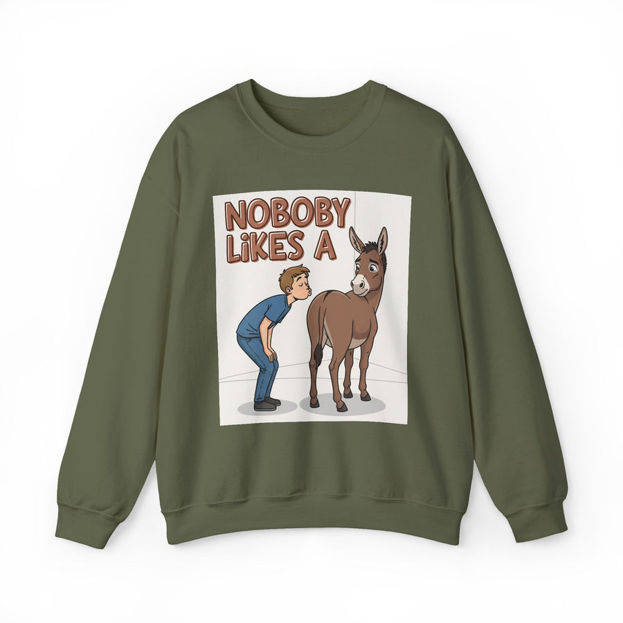 Nobody Likes A (Ass Kisser) — Sweatshirt front flat-lay: NOBODY LIKES A over a cartoon visual pun — a man bending toward a donkey’s rear, the (ass kisser) drawn instead of written — full color on a white panel, olive sweatshirt. Street Talk Designs sarcastic statement apparel.