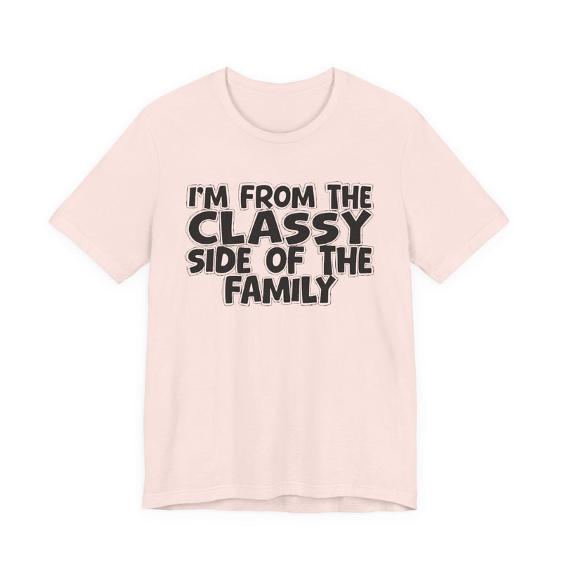 Soft Cream t-shirt with 'I'M FROM THE CLASSY SIDE OF THE FAMILY' in black hand-drawn bubble lettering on the chest, front flat-lay mockup view.