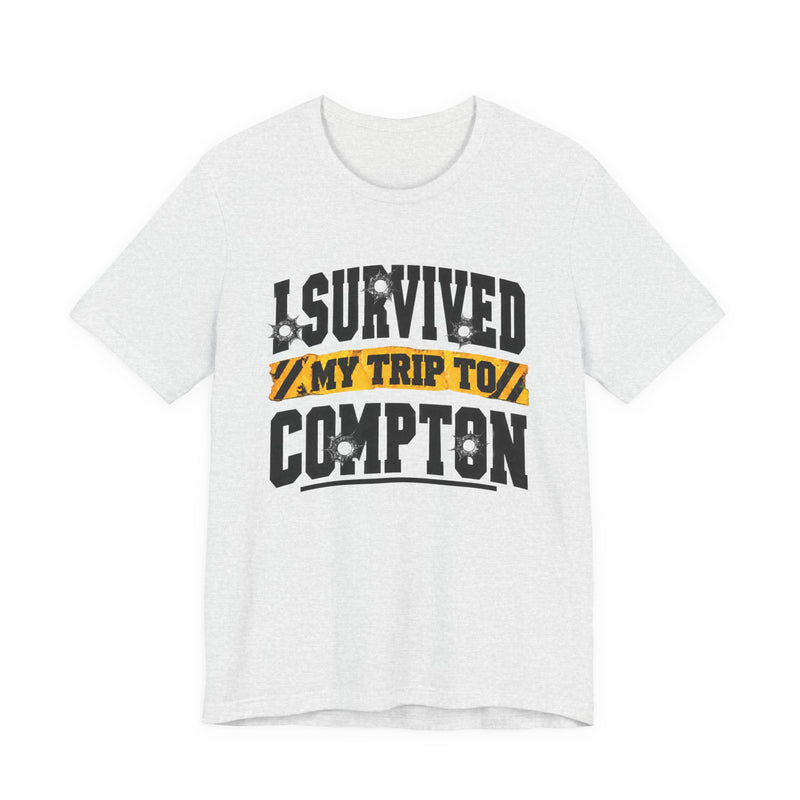 T-Shirt with collegiate lettering reading I SURVIVED MY TRIP TO COMPTON, front view.