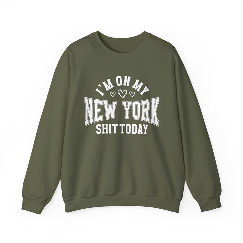 Military green sweatshirt with white varsity block lettering reading I'M ON MY NEW YORK SHIT TODAY, with heart accents, front flat-lay view.