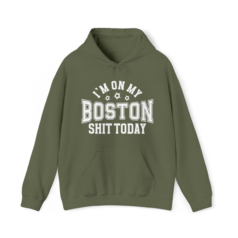 Military green hoodie with white varsity block lettering reading I'M ON MY BOSTON SHIT TODAY, with bullet-hole accents, front flat-lay view.