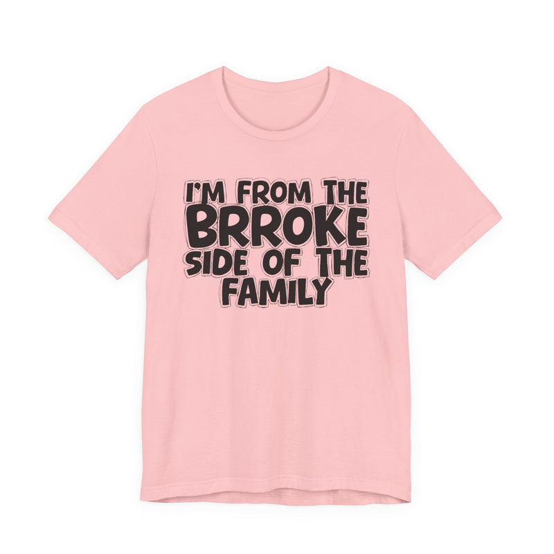 Soft Pink t-shirt with 'I'M FROM THE BRROKE SIDE OF THE FAMILY' in black hand-drawn bubble lettering on the chest, front flat-lay mockup view.