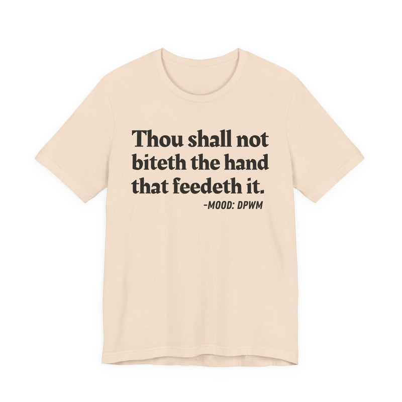 T-Shirt with text design reading “THOU SHALL NOT BITETH THE HAND THAT FEEDETH IT”, front view