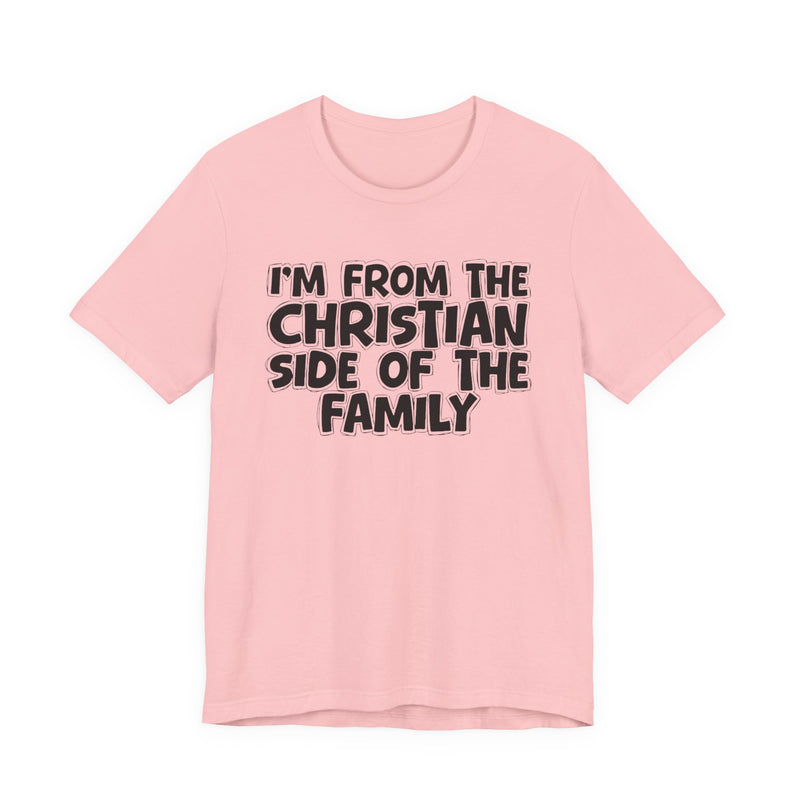 Charity Pink t-shirt with the "I'M FROM THE CHRISTIAN SIDE OF THE FAMILY" statement design in white outlined block lettering, front flat-lay view.
