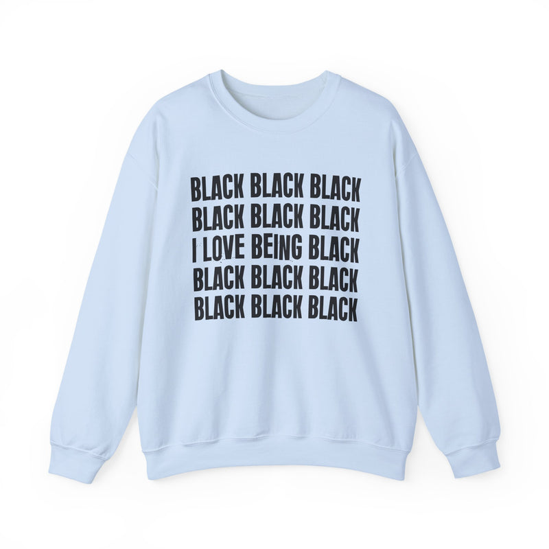 Ash sweatshirt with stacked ‘BLACK BLACK BLACK / I LOVE BEING BLACK / BLACK BLACK BLACK’ block text graphic in dark-contrast print, front flat-lay mockup view