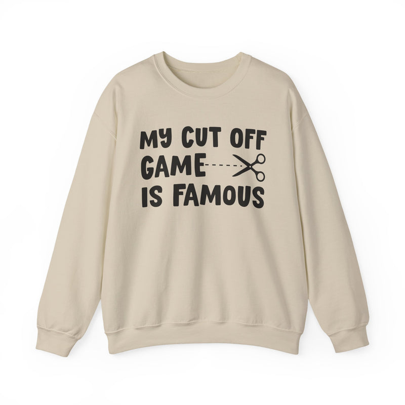 Sand sweatshirt with black bold statement lettering reading MY CUTOFF GAME IS FAMOUS, front flat-lay view.