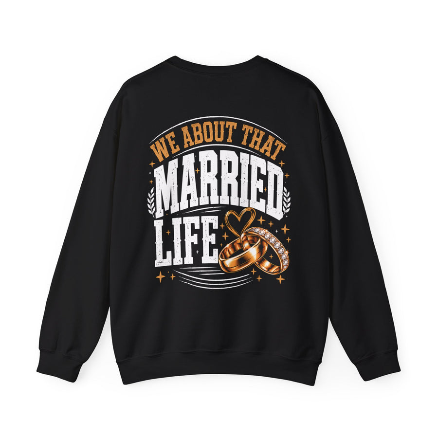 Black sweatshirt with sand collegiate lettering reading WE ABOUT THAT MARRIED LIFE, front flat-lay view.