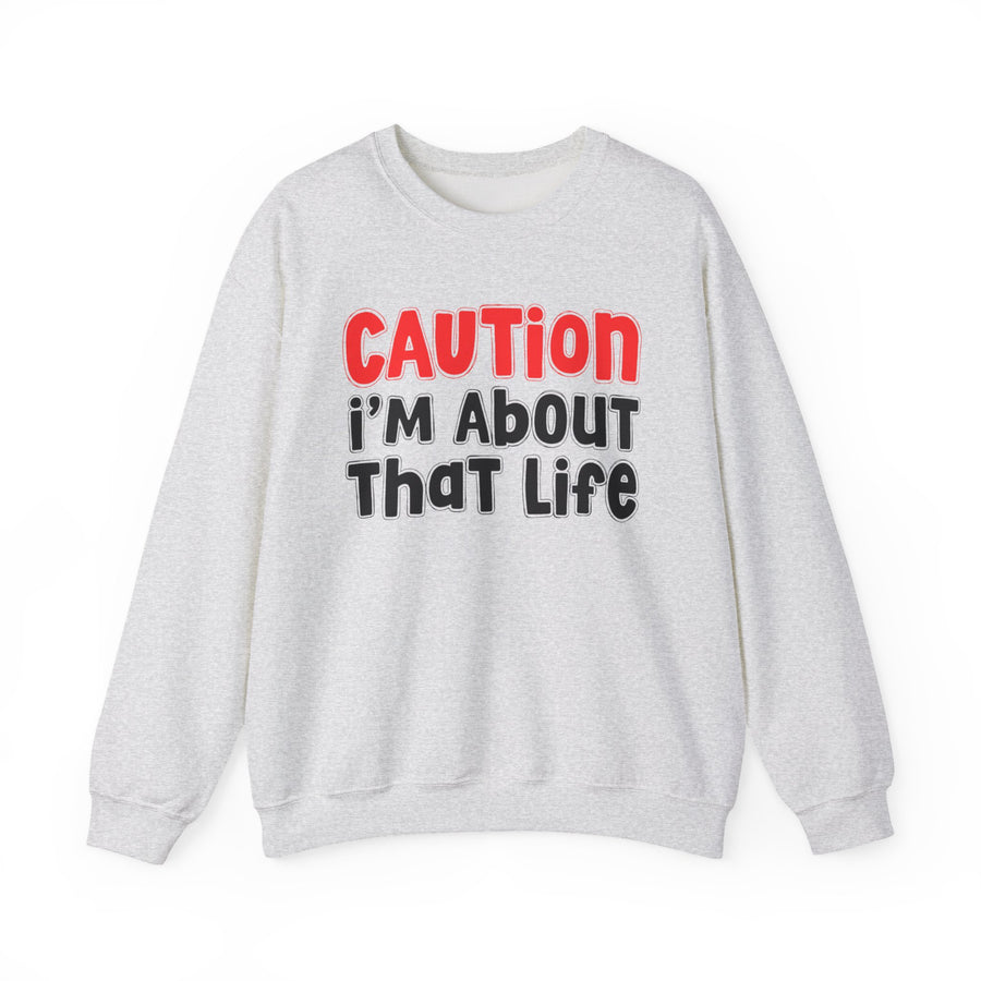 Sweatshirt in Black with lettering reading CAUTION I'M ABOUT THAT LIFE, front view