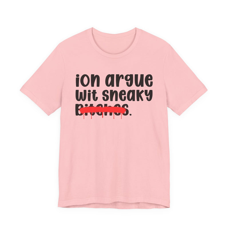 Pink t-shirt with black 'ion argue / wit sneaky' lettering and a red spray-paint strike-through across the last line, front view.