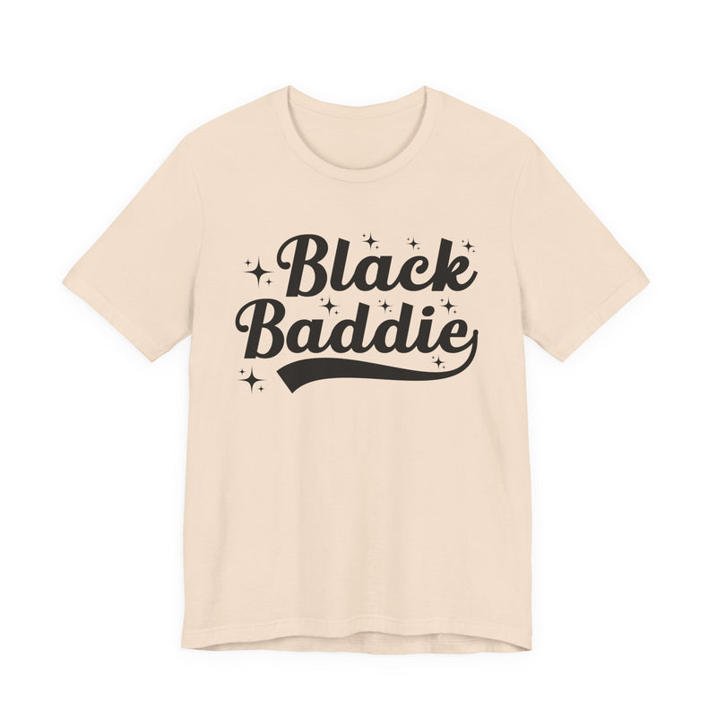 White t-shirt with dark bold statement lettering reading BLACK BADDIE, front flat-lay view.