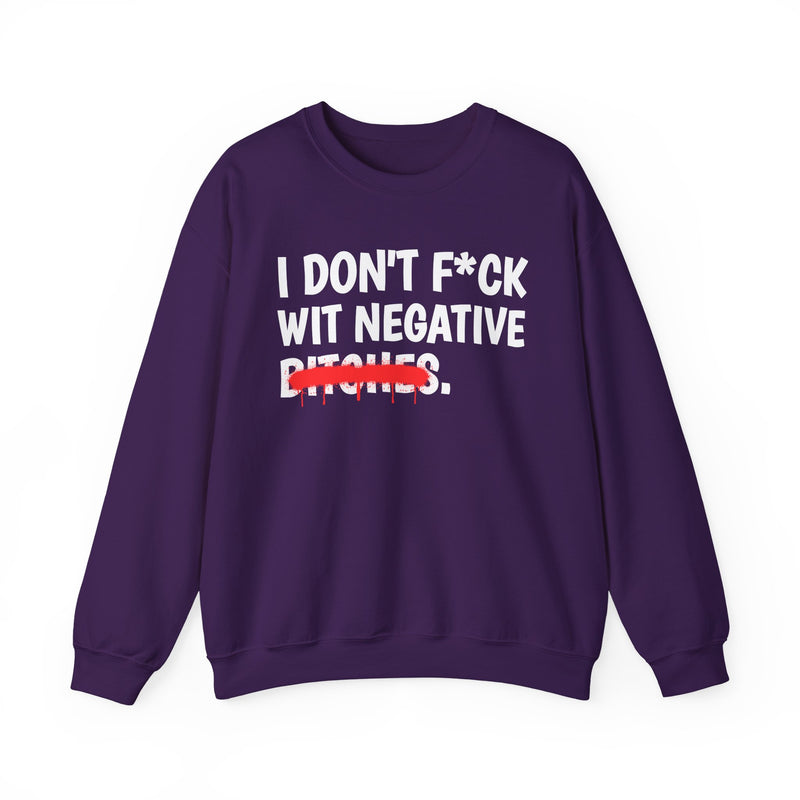 Purple sweatshirt with dark bold boundary lettering reading I DON'T FUCK WIT NEGATIVE BITCHES, front flat-lay view.