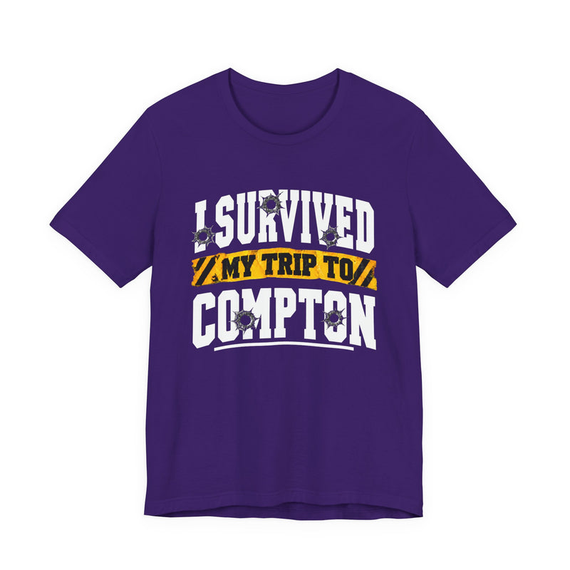 T-Shirt with collegiate lettering reading I SURVIVED MY TRIP TO COMPTON, front view.
