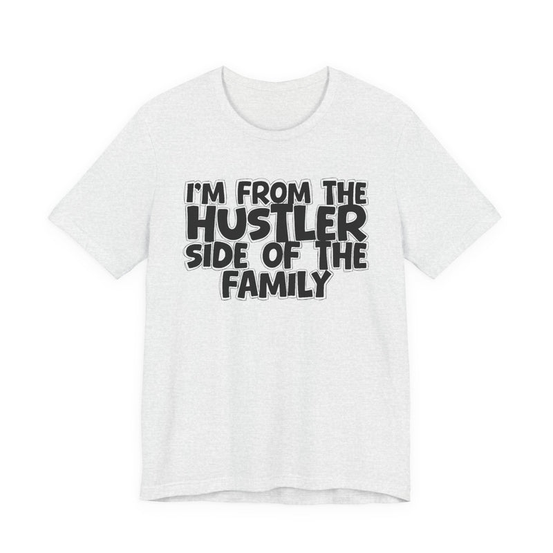 Charity Pink t-shirt with bold chest statement text reading 'I'M FROM THE HUSTLER SIDE OF THE FAMILY,' front flat-lay view.