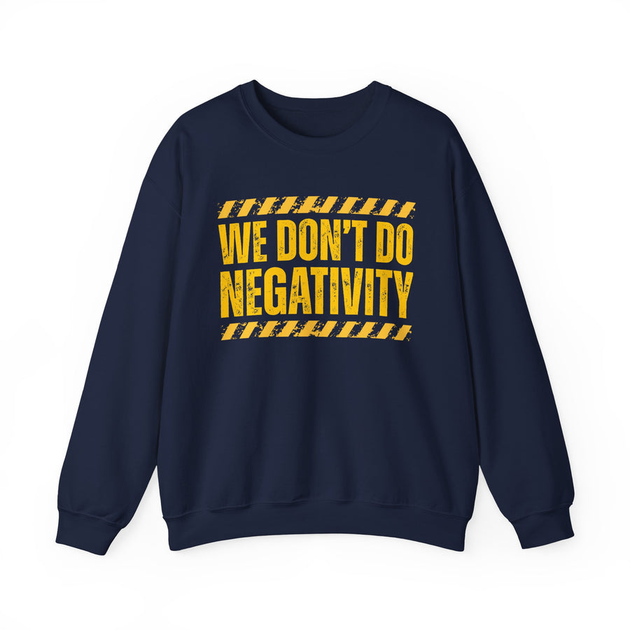 Navy sweatshirt with yellow and red distressed block lettering with hazard-stripe accents reading WE DON'T DO NEGATIVITY, front view.